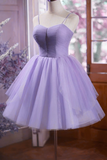 Lavender dress on a mannequin against a blurred indoor background