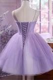 Lavender dress on a mannequin with a blurred floral background
