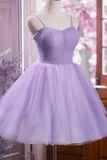 Purple dress on a mannequin against a blurred indoor background