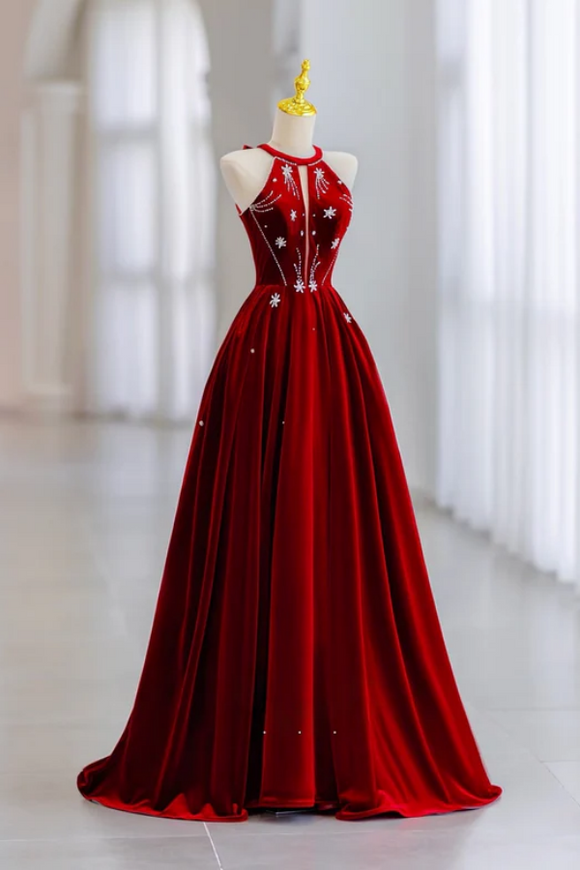 Red evening gown on a mannequin with a blurred white background