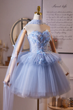 Light blue dress on a mannequin with a decorative background