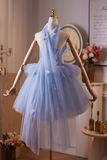 Blue dress on a mannequin in a room with decorative elements