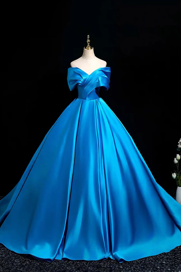 Blue evening gown on a mannequin against a black background