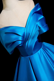 Blue satin dress on a mannequin against a black background