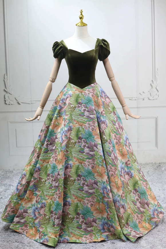 Mannequin wearing a green top and floral skirt against a white wall