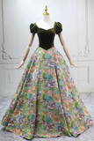 Mannequin wearing a green top and floral skirt against a white wall