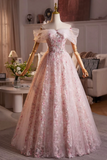 Elegant pink floral dress on a mannequin in a room setting.