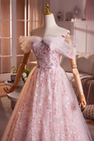 Pink floral dress on a mannequin in a room setting