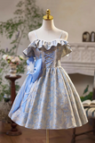 Mannequin wearing a blue and gray dress with decorative elements in a room setting.