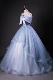 Light blue and white ball gown on a mannequin against a dark background
