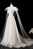White wedding dress with a long veil on a black background