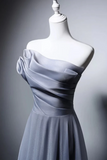 Gray dress on a mannequin against a gray background