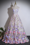 Elegant floral gown on a mannequin against a plain background