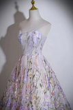 Floral dress on a mannequin against a plain background