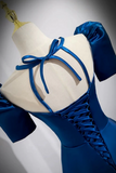 Blue dress on a mannequin with a gray background