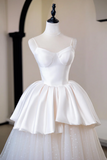 White dress on a mannequin against a neutral background