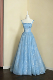 Light blue evening gown on a mannequin against a beige wall.