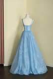 Light blue evening gown on a mannequin against a beige wall.