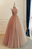 Pink evening gown on a mannequin against a neutral background