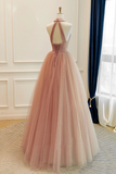 Pink evening gown on a mannequin against a neutral background