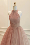 Pink evening gown on a mannequin against a white background