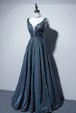 Blue evening gown on a mannequin against a plain background