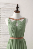 Green dress with brown belt on a mannequin against a white background