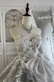 Elegant wedding dress on a mannequin with intricate detailing in a decorative setting.