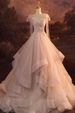Elegant white wedding dress on a mannequin against a scenic background
