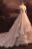 White wedding dress on a mannequin against a scenic background