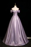 Lavender off-shoulder gown on a mannequin against a black background