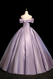Lavender evening gown on a mannequin against a black background