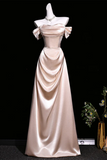 Pink satin evening gown on a black background
