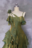 Green dress on a mannequin against a gray background