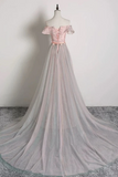 Pink off-shoulder top and gray skirt gown on a mannequin against a white background