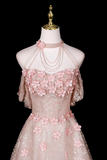 Pink floral dress on a mannequin against a black background