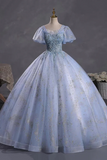 Light blue embroidered gown on a mannequin against a dark background