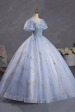 Light blue evening gown on a mannequin against a dark background