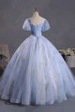 Light blue ball gown on a mannequin against a gray background