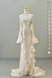 White sequin evening gown on a mannequin against a neutral background
