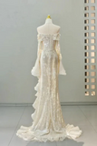 Elegant white evening gown on a mannequin against a neutral background