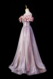 Elegant evening gown on a mannequin against a black background