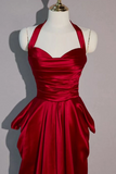 Red satin dress on a mannequin against a plain background