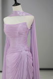 Lavender evening gown on a mannequin against a gray background
