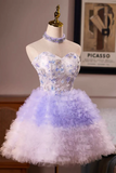 Short, strapless dress with floral top and ruffled skirt on a mannequin against a neutral background.