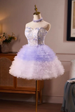 Short, strapless dress with floral lace and ruffled skirt on a mannequin against a neutral background.