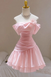 A light pink off-the-shoulder short dress displayed on a white mannequin torso with a jeweled collar. The dress features a structured bodice, a ruffled oversize sleeve, and a tiered skirt.