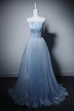 A strapless light blue ball gown with a pleated tulle skirt and a fitted bodice, displayed on a white mannequin against a dark gray studio background.