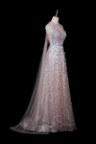 A floor-length formal gown displayed on a mannequin against a black background. The dress has a sheer illusion neckline, a fitted bodice covered in iridescent sequins, and a flowing tulle skirt with matching sequins and a long sheer veil.