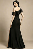 Woman wearing a black off-shoulder evening gown with ruffles on a beige background